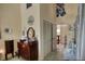 Charming hallway with classic wooden dresser and serene decor at 25188 Marion Ave # 1013, Punta Gorda, FL 33950