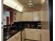Efficient kitchen with bright cabinetry and dark countertops at 25188 Marion Ave # 1013, Punta Gorda, FL 33950