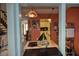 View of the kitchen and reading room from the adjacent dining room at 25188 Marion Ave # 1013, Punta Gorda, FL 33950