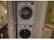 Stacked washer and dryer set conveniently located near living spaces at 25188 Marion Ave # 1013, Punta Gorda, FL 33950