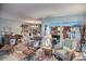 Bright living room with stylish seating and views into the kitchen at 25188 Marion Ave # 1013, Punta Gorda, FL 33950