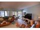 Cozy living room leading to a screened porch, perfect for relaxation at 25188 Marion Ave # 1013, Punta Gorda, FL 33950