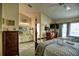 Spacious main bedroom with a four-poster bed and an en-suite bathroom at 25188 Marion Ave # 1013, Punta Gorda, FL 33950
