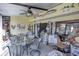 Enclosed patio featuring a ceiling fan, neutral tones, and decorative fish wall art at 25188 Marion Ave # 1013, Punta Gorda, FL 33950