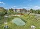 View of the community putting green, showcasing meticulous landscaping and recreational amenities at 25188 Marion Ave # 1013, Punta Gorda, FL 33950