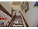 Staircase featuring carpet runner and light wood railing at 25188 Marion Ave # 1013, Punta Gorda, FL 33950