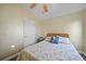 Cozy bedroom with a charming beachy theme and a ceiling fan for added comfort at 27002 Clear Creek Way, Punta Gorda, FL 33950