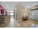 Inviting home foyer featuring tile floors, a charming console table and a view of the kitchen and laundry room at 27002 Clear Creek Way, Punta Gorda, FL 33950