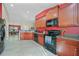 Well-equipped kitchen with modern appliances, ample countertop space, and stylish cabinetry at 27002 Clear Creek Way, Punta Gorda, FL 33950