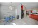Bright eat-in kitchen featuring blue chairs, modern appliances and view of the dining room at 27002 Clear Creek Way, Punta Gorda, FL 33950