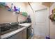 Well-equipped laundry room with modern appliances, ample storage, and convenient access at 27002 Clear Creek Way, Punta Gorda, FL 33950