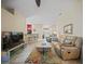 Open living area with tile flooring, comfortable seating, and ample natural light at 27002 Clear Creek Way, Punta Gorda, FL 33950
