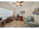 Well-lit office space with neutral walls, vaulted ceilings, tile flooring and comfortable seating at 27002 Clear Creek Way, Punta Gorda, FL 33950