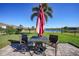 Outdoor patio showcasing a seating area with a lake view, perfect for relaxing and entertaining guests at 27002 Clear Creek Way, Punta Gorda, FL 33950