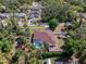 Aerial view of the home featuring the pool, backyard, and mature trees at 3172 Sikeston Ave, North Port, FL 34286