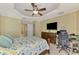 Bedroom featuring a ceiling fan, large bed, and desk area at 3172 Sikeston Ave, North Port, FL 34286