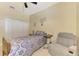 Bedroom featuring a ceiling fan, carpeted floor, and a comfortable seating at 3172 Sikeston Ave, North Port, FL 34286