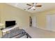 Bedroom featuring a ceiling fan, carpeted floor, and a treadmill at 3172 Sikeston Ave, North Port, FL 34286