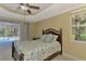 Bedroom with queen-size bed with ceiling fan and sliding door to screened pool at 3172 Sikeston Ave, North Port, FL 34286