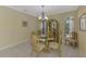 Bright dining room with glass table, cabinet and tiled floors perfect for entertaining at 3172 Sikeston Ave, North Port, FL 34286