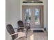 Front porch features double doors and wicker seating at 3172 Sikeston Ave, North Port, FL 34286