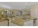 Kitchen bar with a view of dining area and screened pool beyond at 3172 Sikeston Ave, North Port, FL 34286