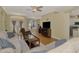 Open-concept living room and dining room with hardwood floors and bright lighting at 3172 Sikeston Ave, North Port, FL 34286