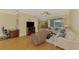 Comfortable living room with hardwood floors, a ceiling fan, and access to the outdoors at 3172 Sikeston Ave, North Port, FL 34286