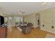 Cozy living room with wood floors, ceiling fan, neutral tones, and views of the lanai at 3172 Sikeston Ave, North Port, FL 34286