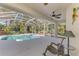 Relaxing screened lanai offers pool and spa with ample seating and lush tropical landscaping at 3172 Sikeston Ave, North Port, FL 34286