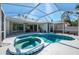 Screened lanai featuring a pool and spa offers a private outdoor oasis at 3172 Sikeston Ave, North Port, FL 34286