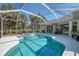 Beautiful backyard with screened pool and spa, perfect for entertaining and relaxation at 3172 Sikeston Ave, North Port, FL 34286