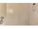 Shower area featuring neutral tile walls, adjustable shower head, and chrome hardware at 3172 Sikeston Ave, North Port, FL 34286