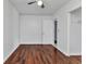 Bedroom with wood floors and access to bathroom at 3243 Elkcam Blvd, Port Charlotte, FL 33952