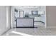 Bright, open kitchen with white cabinets, marble countertops, and a peninsula island at 3243 Elkcam Blvd, Port Charlotte, FL 33952