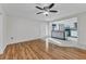 Open-concept living room with wood floors and a view of the modern kitchen at 3243 Elkcam Blvd, Port Charlotte, FL 33952