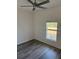 Bright bedroom with stylish laminate flooring, a modern ceiling fan, and a window at 383 Arbor St, Port Charlotte, FL 33953