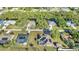 Aerial view of a well-maintained subdivision featuring large lots and beautiful landscaping at 3880 Pinstar Ter, North Port, FL 34287