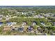 Neighborhood featuring mature trees and well-maintained landscaping near a winding waterway at 3880 Pinstar Ter, North Port, FL 34287