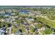 Overhead view showcasing a waterfront community surrounded by trees and well-kept residences at 3880 Pinstar Ter, North Port, FL 34287