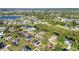 Neighborhood with homes, pools, mature trees and access to a waterway and lush foliage at 3880 Pinstar Ter, North Port, FL 34287