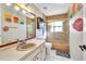 Traditional bathroom featuring a shower over tub, vanity with sink, and neutral accents at 3880 Pinstar Ter, North Port, FL 34287