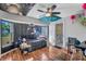 Eclectic bedroom with colorful decor, ceiling fan, and dark accent wall, creating a unique space at 3880 Pinstar Ter, North Port, FL 34287