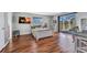 Charming bedroom featuring hardwood floors and a sliding glass door to the screened-in pool area at 3880 Pinstar Ter, North Port, FL 34287