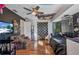 Eclectic bedroom with colorful decor, ceiling fan, and dark accent wall, creating a unique space at 3880 Pinstar Ter, North Port, FL 34287