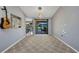Bright, airy dining room with neutral walls and carpeted floors; sliding glass door for backyard access at 3880 Pinstar Ter, North Port, FL 34287