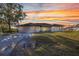 Charming single-story home with a well-manicured lawn and beautiful landscaping details at 3880 Pinstar Ter, North Port, FL 34287