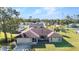 Front exterior of a well-manicured single-story home with a 2-car garage and lush lawn at 3880 Pinstar Ter, North Port, FL 34287