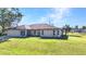A sunny exterior shot of a single-story home with a two-car garage and well-maintained lawn at 3880 Pinstar Ter, North Port, FL 34287