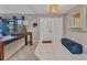 Inviting foyer with modern tile flooring, a stylish entry table, and double doors that welcome guests at 3880 Pinstar Ter, North Port, FL 34287